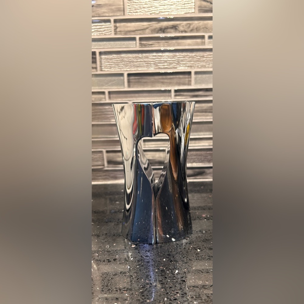 Salt and pepper shakers - silver with heart shape center when together